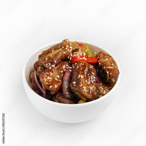 Chinese style pork ribs in soy sauce on a white background, isolate