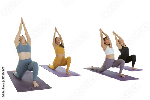 Young women doing Virabhadrasana 1 pose, while practicing yoga in a studio in Mexico City