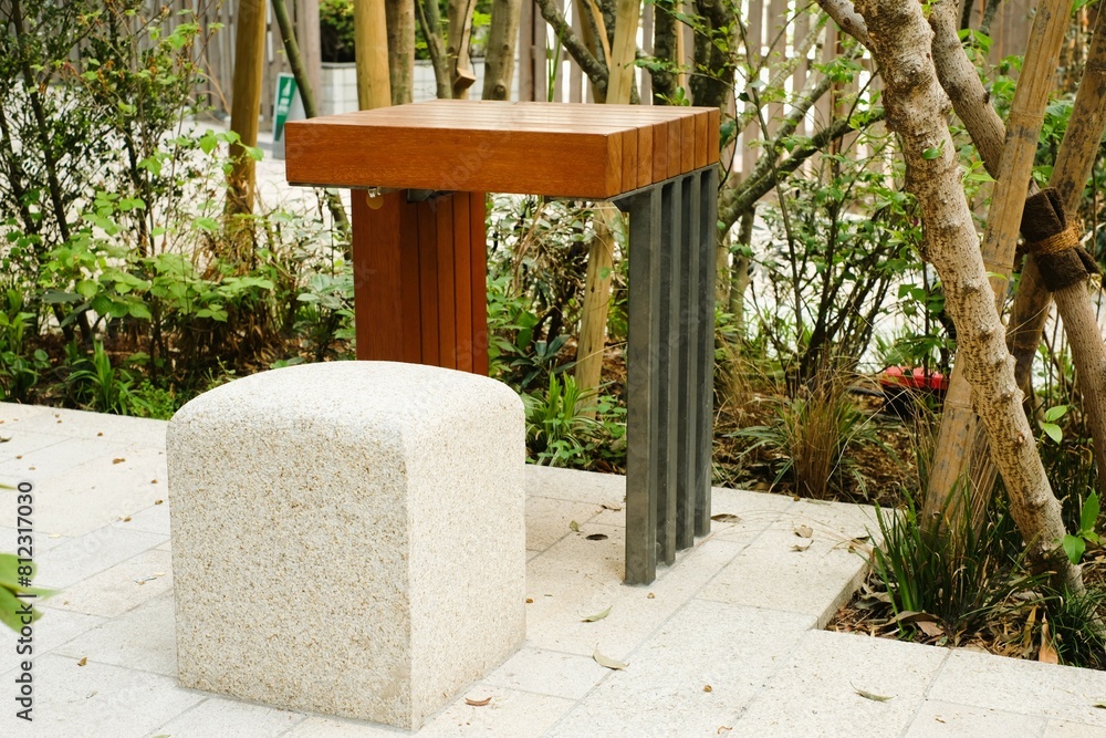 wooden table and stone bench in the garden wooden table and stone bench in the garden