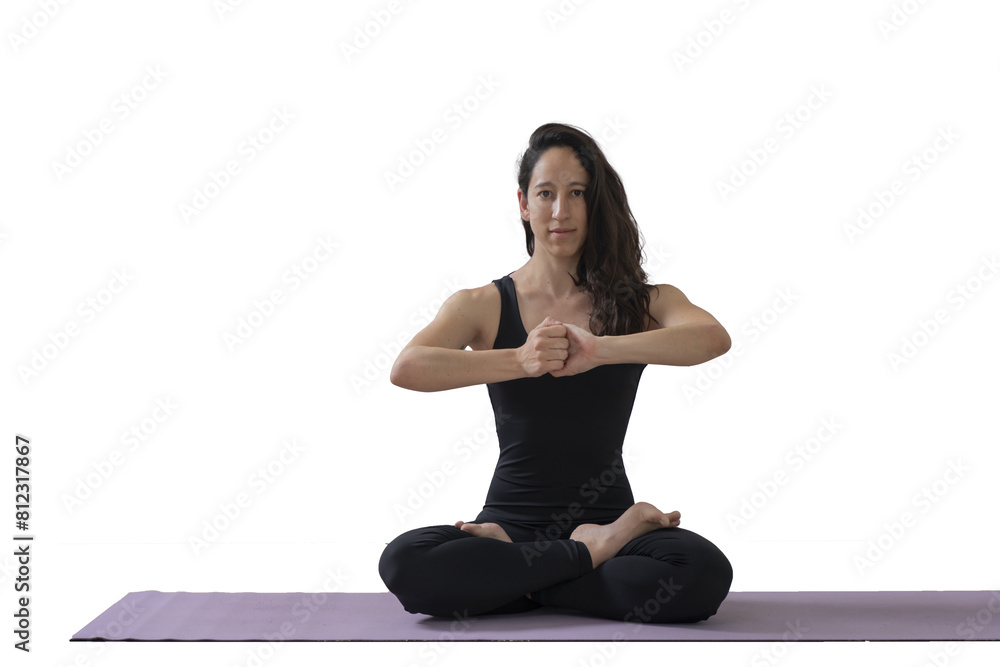 Fototapeta premium Woman in black sportswear practices yoga doing Padmasana or Lotus Pose inside a studio