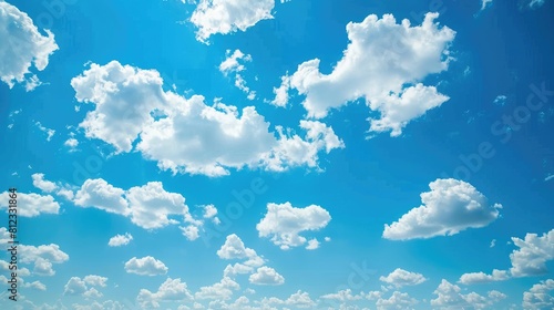 Background of clear blue sky with small clouds