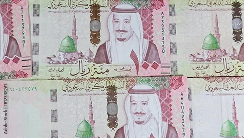 Saudi Arabia 100 riyals banknotes, The Saudi riyal is the currency of Saudi Arabia, Saudi kingdom one hundred riyals  with the photo of king Salman Bin Abdulaziz and Madinah Prophet mosque photo