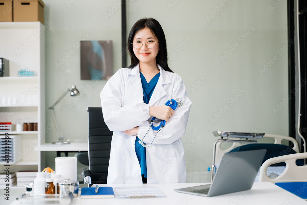 Beautiful physician doctor sit on table in office hospital. Attractive therapist female practitioner pharmacist smile Beautiful physician doctor sit on table in office hospital. Attractive therapist female practitioner pharmacist smile