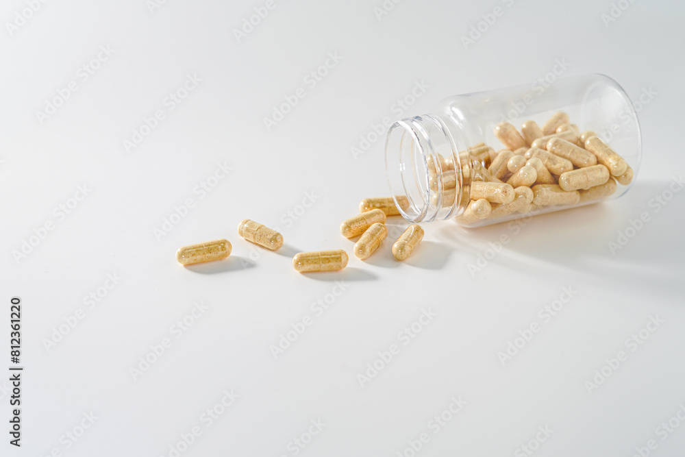 Transparent bottle with pills on white background Transparent bottle with pills on white background