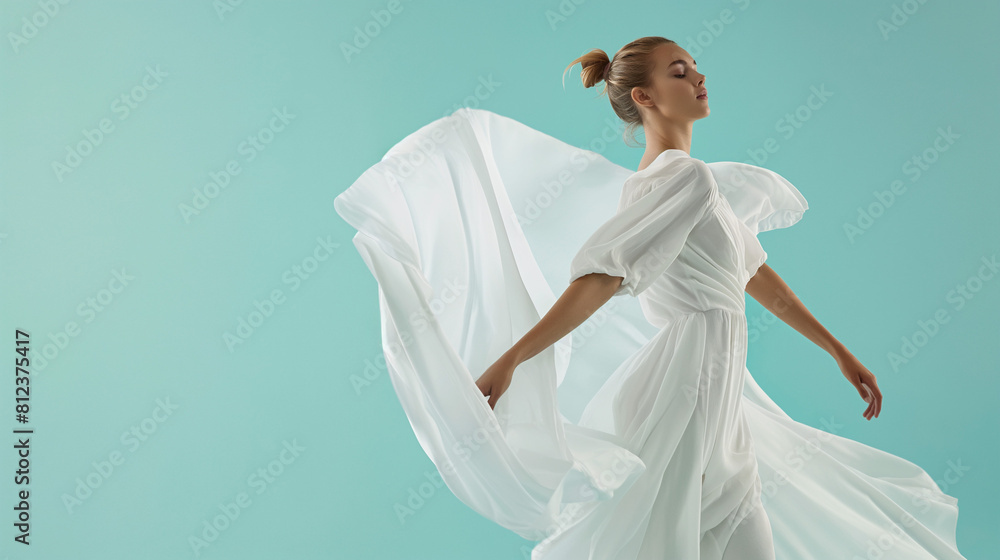 The model is presenting a flowing white outfit, against a light blue background The model is presenting a flowing white outfit, against a light blue background