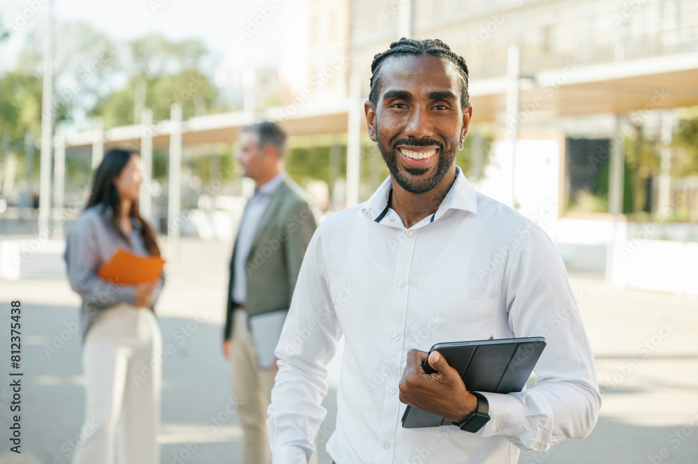 portrait of young smiling business man, freelance worker portrait of young smiling business man, freelance worker