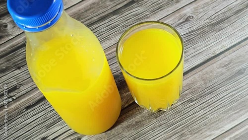 Orange juice is a liquid extract of the orange tree fruit, produced by squeezing or reaming oranges, with varieties including blood orange, navel oranges, valencia orange, clementine, and tangerine photo