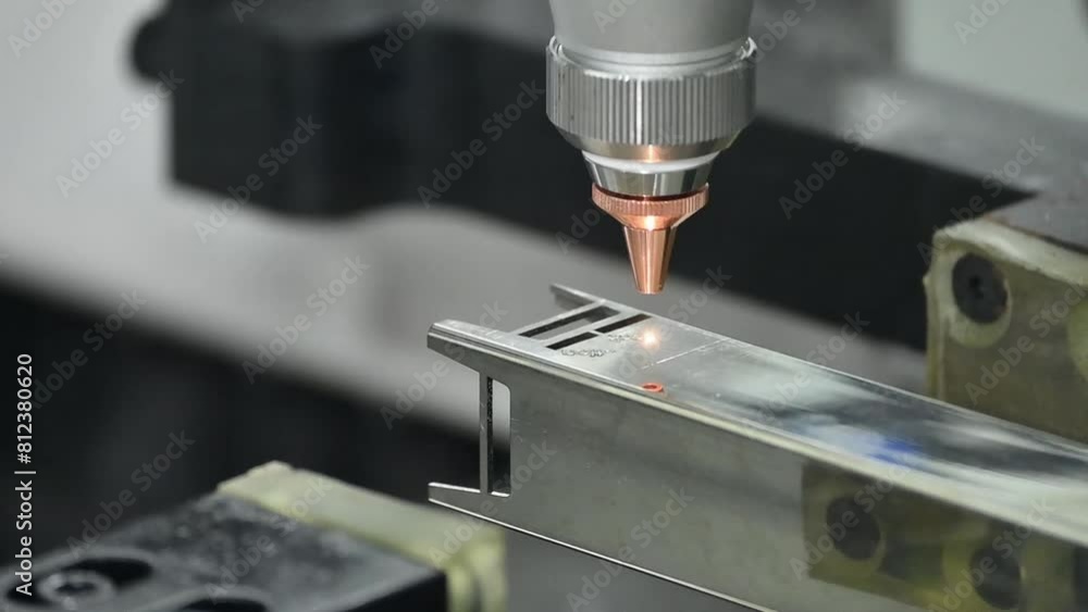 Close up scene the fiber laser cutting machine cut the stainless steel square tube and sparkling light. Close up scene the fiber laser cutting machine cut the stainless steel square tube and sparkling light.