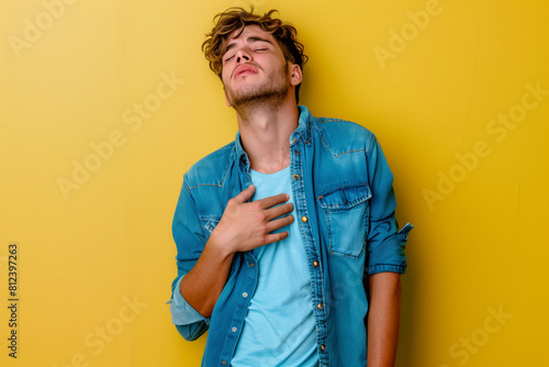 Man holds chest, concerned for psychological and physical health photo
