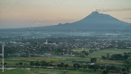 Timelapse sunrise at Riyadi Hill, there is over the cloud and Merapi Mount photo