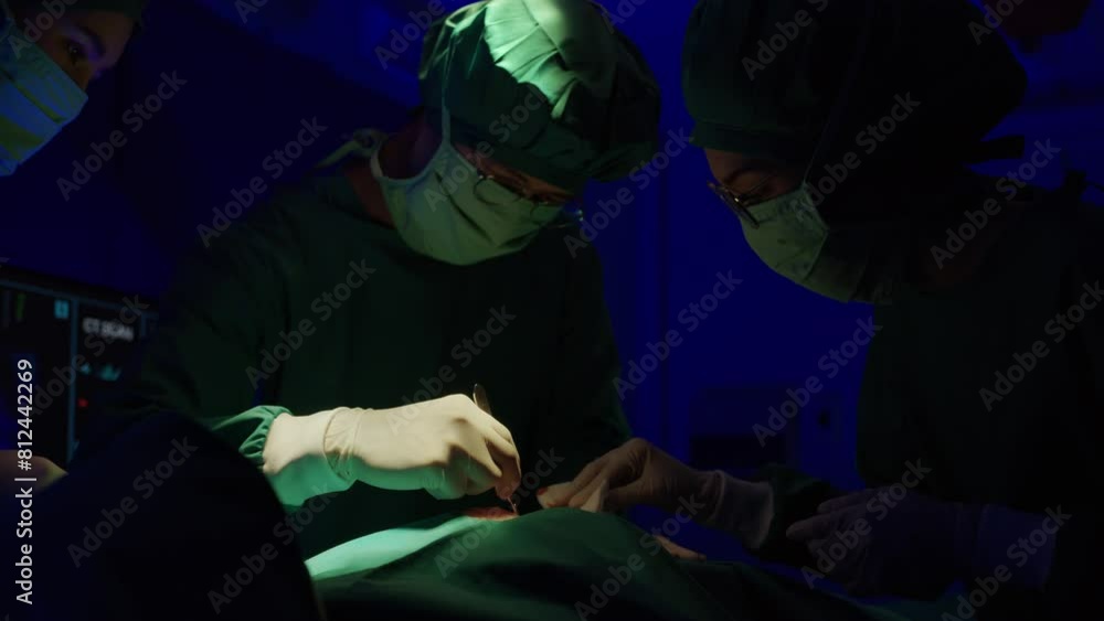 A surgical team in an operating room, illustrating precision and teamwork in medical surgery A surgical team in an operating room, illustrating precision and teamwork in medical surgery