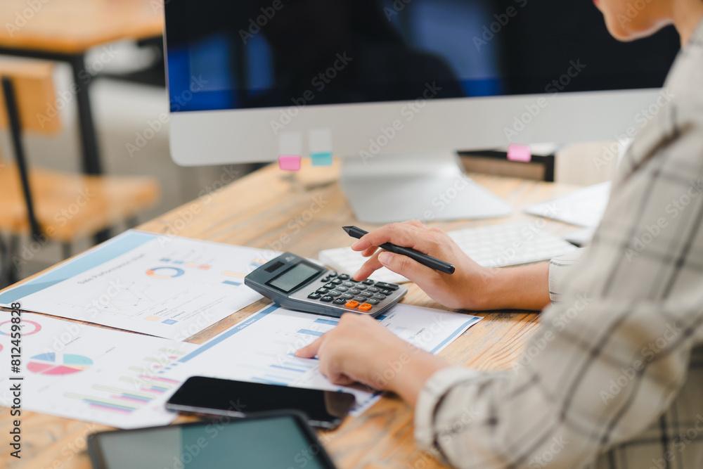 Young woman checking bills, taxes, bank account balance and calculating expenses at desk. Young woman checking bills, taxes, bank account balance and calculating expenses at desk.