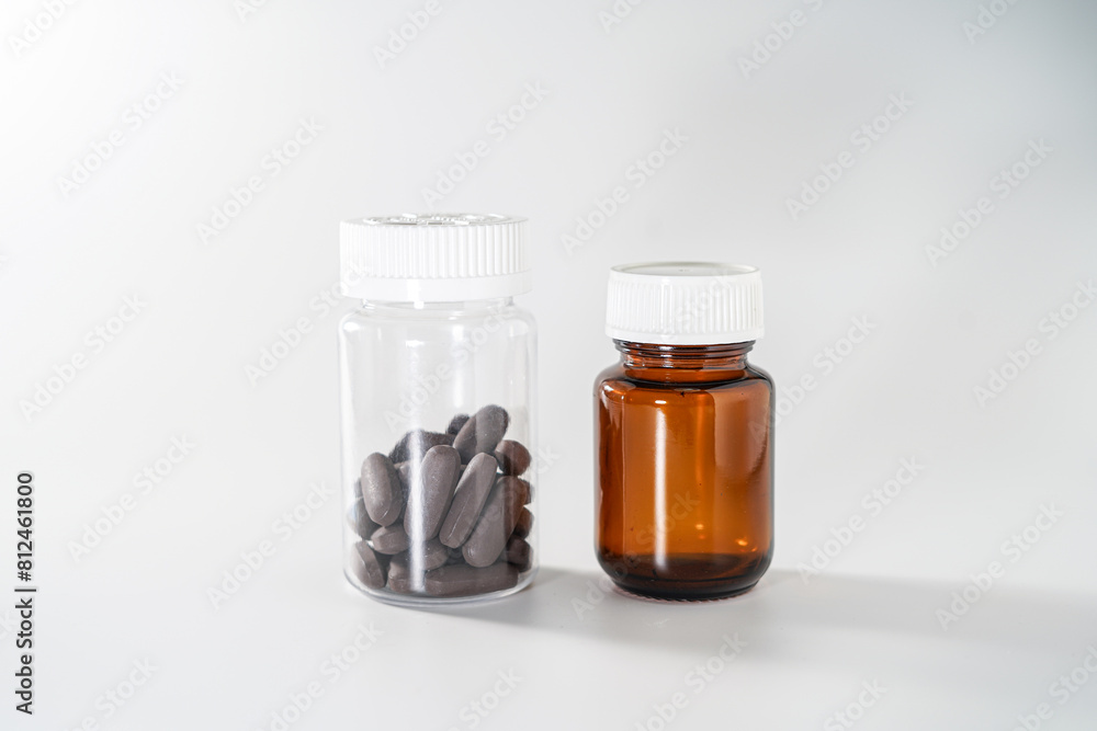 several bottles containing pills and capsules several bottles containing pills and capsules