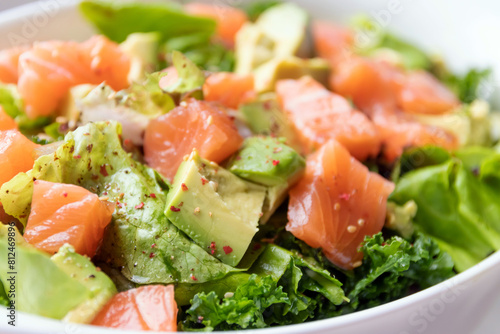 Healthy salad with avocado and fresh salmon. A delicious and healthy option for a light meal.