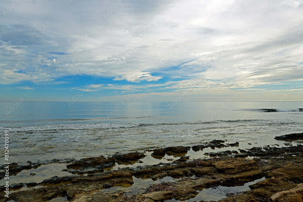 Beautiful evening sky over the sea on the shore of the city of Torrevieja in Spain Beautiful evening sky over the sea on the shore of the city of Torrevieja in Spain