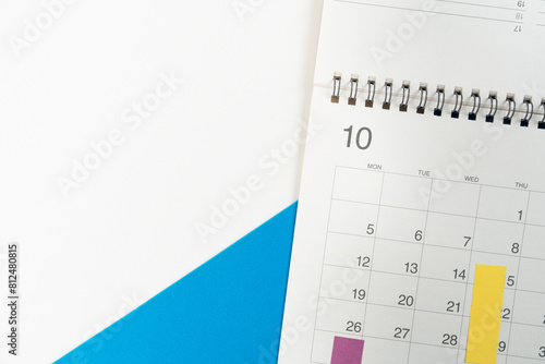 close up of calendar on the blue table background, planning for business meeting or travel planning concept