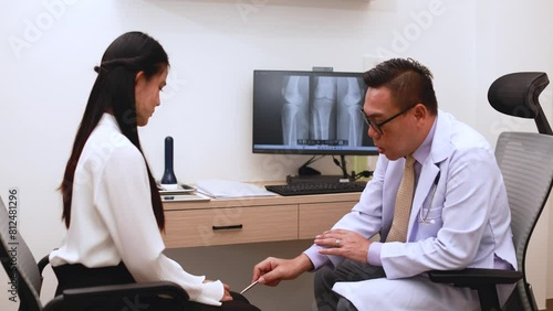 Doctor pointing on the knee problem point on x-ray film. x-ray film show skeleton knee on film. Surgery medical technology concept. Osteoarthritis in the