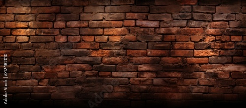 An aged dimly lit brick wall with a repetitive pattern providing space for copy or images. Creative banner. Copyspace image