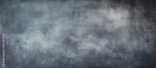 An abstract chalkboard background with a stained white chalk color providing a copy space image