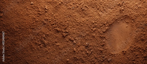 The coarse and gritty texture of sandpaper ideal for smoothing rough surfaces is captured in this close up copy space image photo