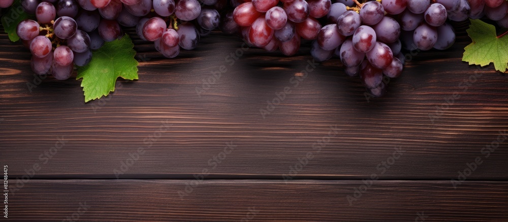 There are ripe bunches of grapes on the table serving as a healthy and natural organic product The top view allows for text placement offering copy space for keto or paleo diet promotions The grapes There are ripe bunches of grapes on the table serving as a healthy and natural organic product The top view allows for text placement offering copy space for keto or paleo diet promotions The grapes