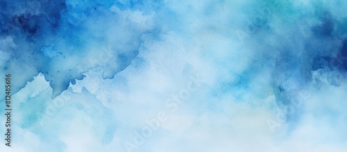 A blue background with watercolour paints providing ample copy space for additional elements