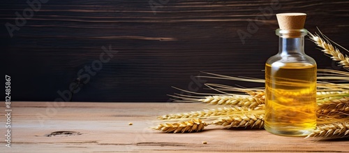 A bottle of wheat germ oil is placed on a wooden surface creating a captivating copy space image