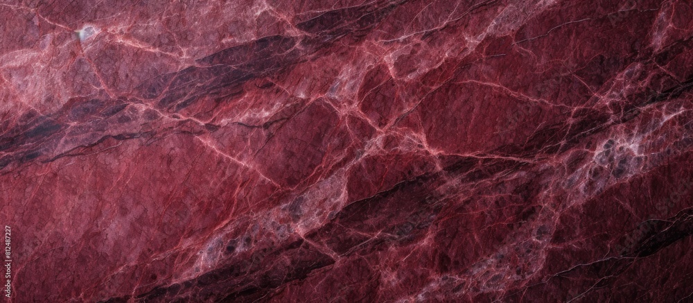 Close up image of a polished dark red granite background with a textured natural appearance Ample space for inserting content Close up image of a polished dark red granite background with a textured natural appearance Ample space for inserting content