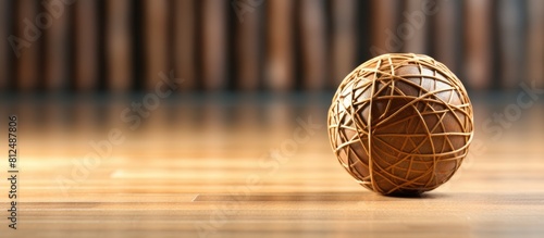 Close up view of a popular sport in Asia featuring a rattan ball or Sepak Takraw ball on the floor with copy space image photo