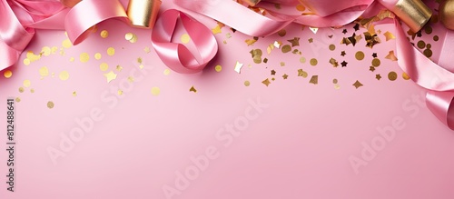A modern composition showcasing golden decorations confetti tubules and streamers on a vibrant pink background creating a cheerful concept for a girl s birthday celebration The arrangement is capture photo