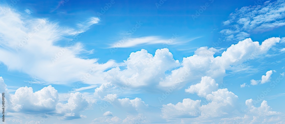 The expansive sky with its tranquil blue hue and fluffy clouds. Creative banner. Copyspace image The expansive sky with its tranquil blue hue and fluffy clouds. Creative banner. Copyspace image