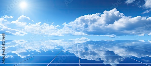 A copy space image featuring a fresh solar panel positioned against a vibrant blue sky with a scattering of clouds casting reflections on the panels