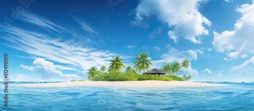 Copy space image of a serene summer day at a tropical island paradise with a clear blue sky adorned by fluffy white clouds and illuminated by the morning sunlight