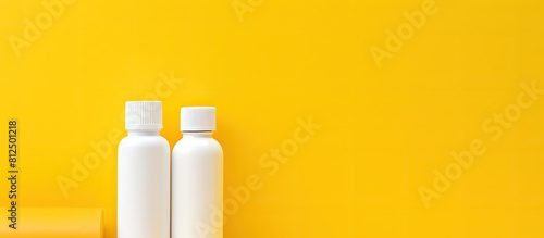 A stationery item specifically a PVA glue bottle is showcased on a vibrant yellow background providing ample copy space for additional elements in an image photo