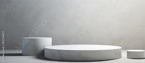 A side view of white table with gray concrete circle shaped pedestals offering copy space for a stunning image It serves as a stone platform and an abstract geometric pedestal with a design perfect f