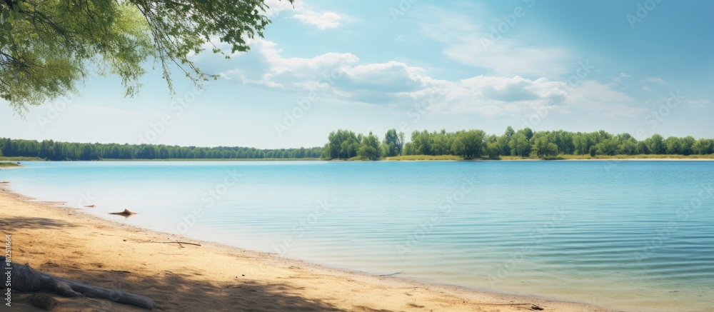 A tranquil summer scene where a pristine blue lake meets a sandy beach devoid of any human presence offers a serene copy space image A tranquil summer scene where a pristine blue lake meets a sandy beach devoid of any human presence offers a serene copy space image