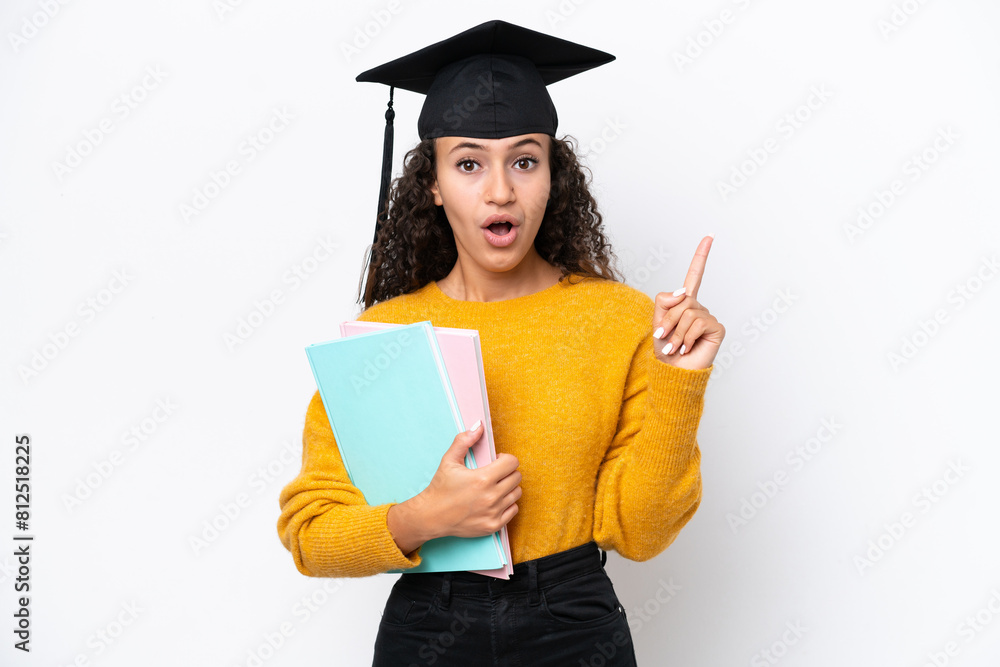 Arab university graduate woman holding books isolated on white background intending to realizes the solution while lifting a finger up Arab university graduate woman holding books isolated on white background intending to realizes the solution while lifting a finger up