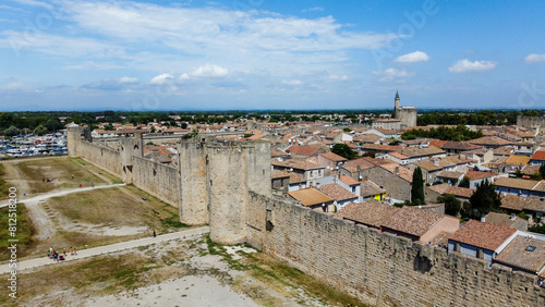 Fortified city of Aigues-Mortes, in Provence in France. Entirely surrounded by an imposing city wall and purple salt pans of incredible beauty, Aigues-Mortes is a jewel, an enchanting medieval village