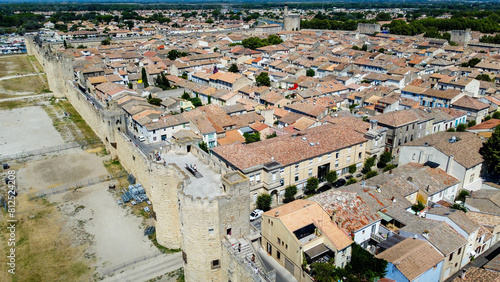 Citadel of the city of Aigues-Mortes seen from a drone. Medieval village with a rectangular plan delimited by a city wall. Tourist town is located near the salt pans and the purple sea. Provence photo