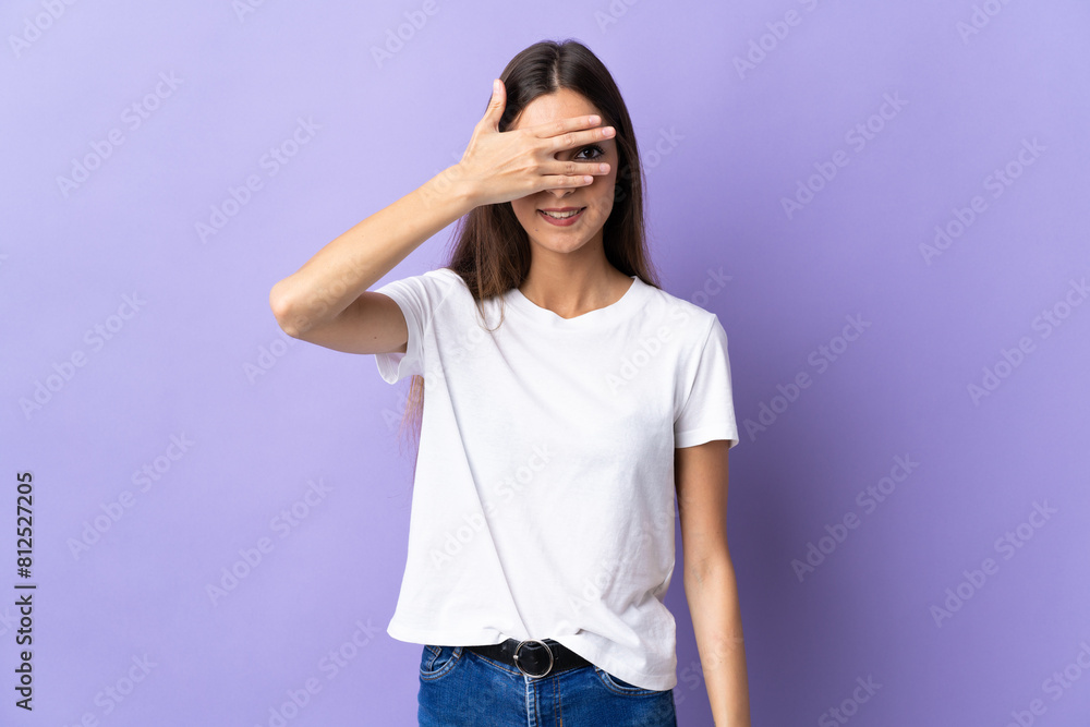 Young caucasian woman isolated on blue background covering eyes by hands and smiling Young caucasian woman isolated on blue background covering eyes by hands and smiling