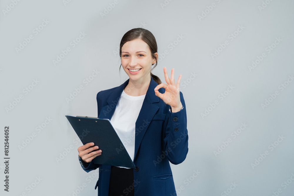 Happy young businesswoman presenting or pointing, happy working. Happy young businesswoman presenting or pointing, happy working.