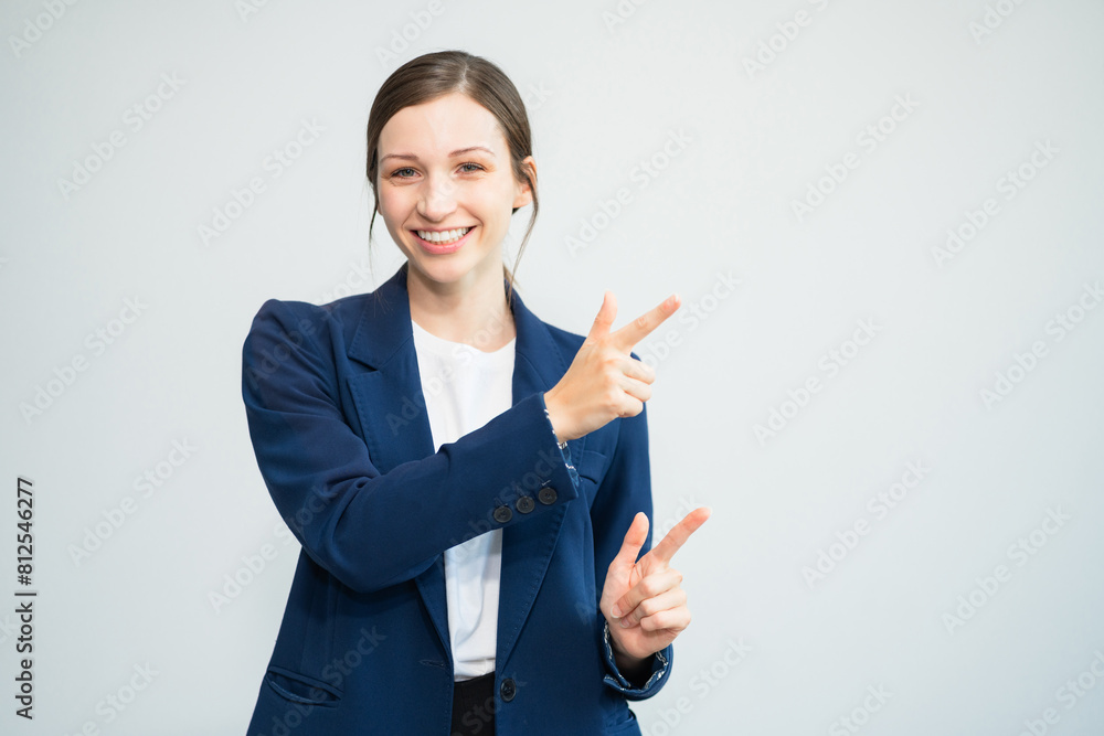 Happy young businesswoman presenting or pointing, happy working. Happy young businesswoman presenting or pointing, happy working.