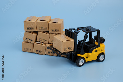Many carton boxes and forklift track. Cargo concept.