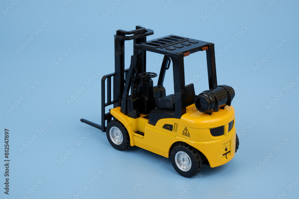 Yellow forklift truck on blue background Yellow forklift truck on blue background