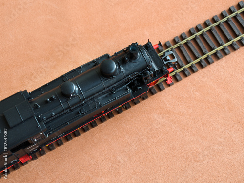 Model of a locomotive on a dark background. © Natalia