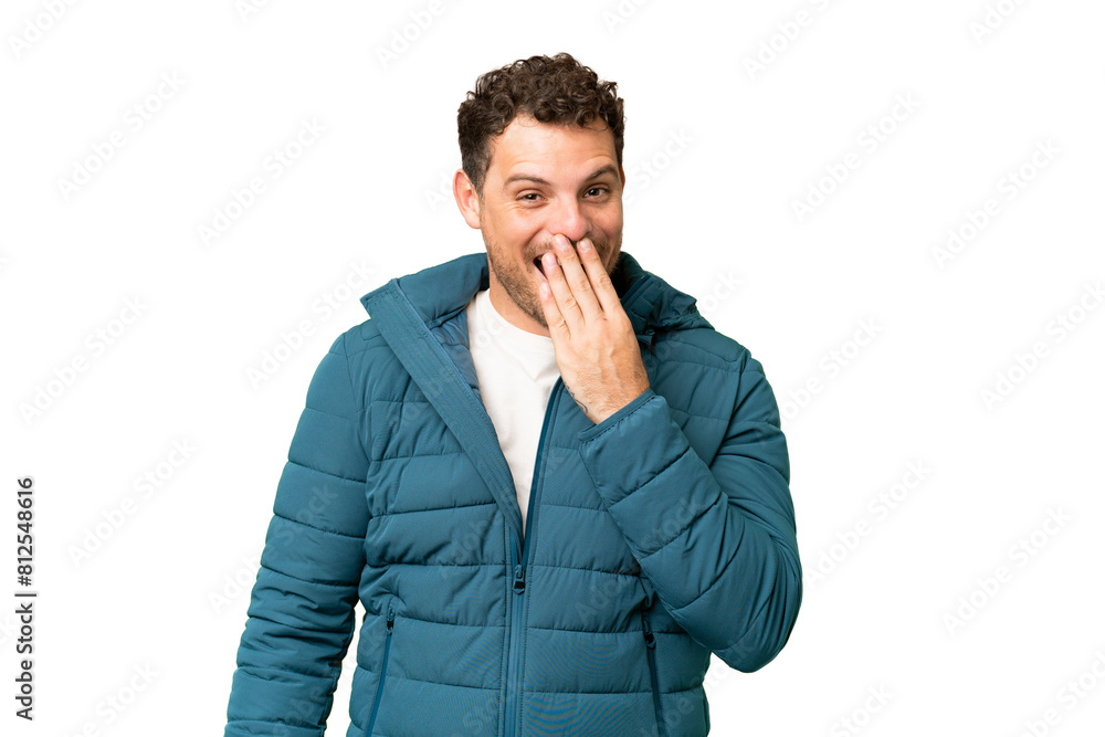 Brazilian man over isolated chroma key background happy and smiling covering mouth with hand Brazilian man over isolated chroma key background happy and smiling covering mouth with hand