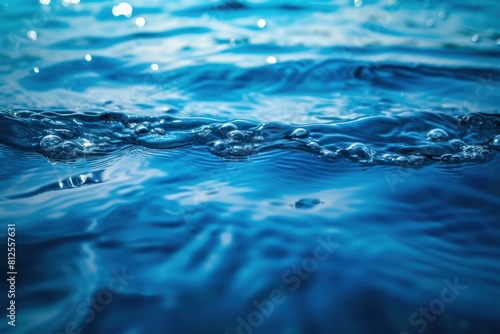 Close-up of the tranquil texture of a shimmering blue water surface