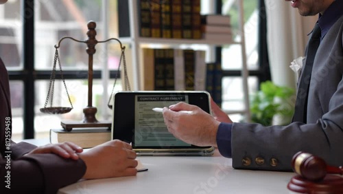 Lawyers provide legal advice and chat with clients via online tablets to clarify and give advice on the rules in contract documents that must be followed at the company correctly and fairly. photo