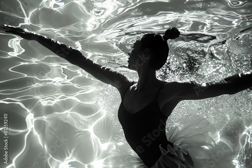 Capture the dynamic elegance of aquatic choreography with dramatic shadows and reflections