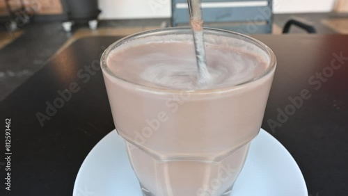 Whipping Up Chocolatey Bliss: Mesmerizing Footage of the Perfect Chocolate Milkshake Being Whisked to Frothy Perfection - Dive into the Decadence photo